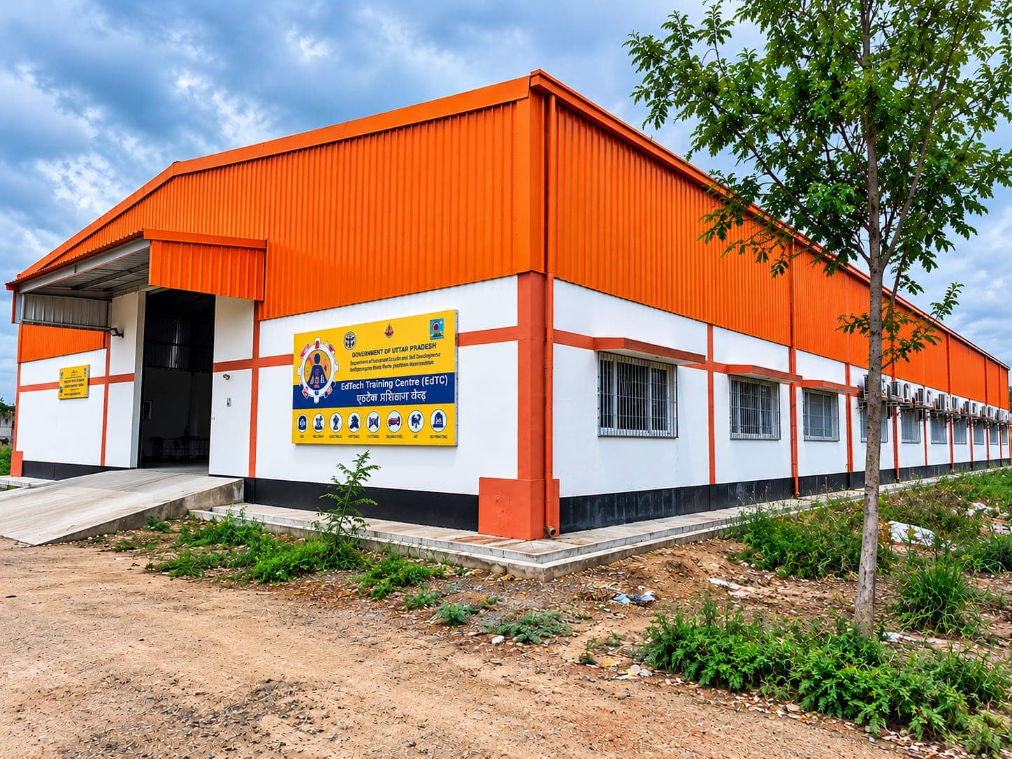 Long training centre building with an orange metal roof