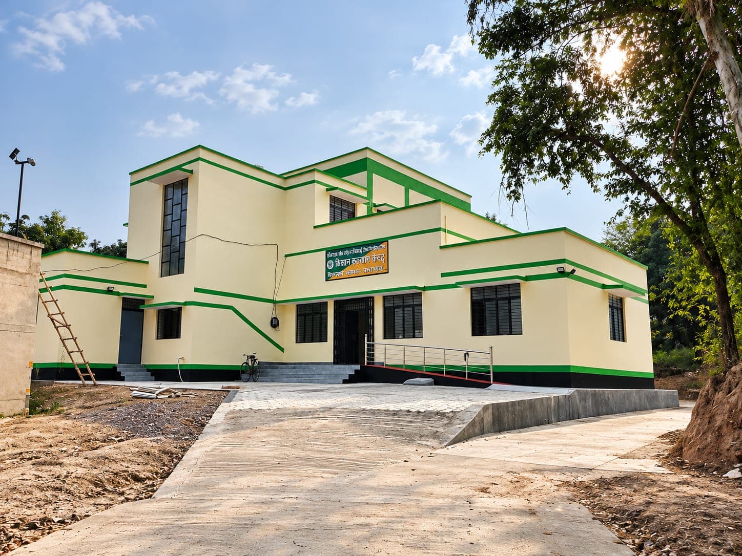 Cream Kisan Kalyan Kendra building with green trim at Garhmukteshwar