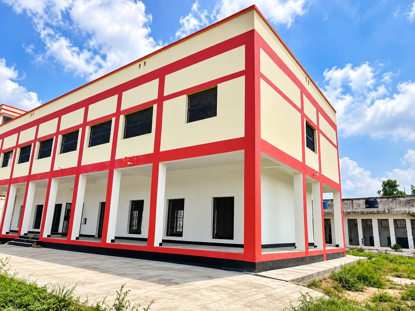 Red and cream two-storey simple barrack building at District Jail Bulandshahr